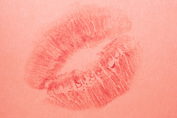 Red lipstick imprints on pink paper, kiss, beautiful red lips