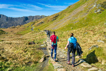 Hikers on Pyg track at Pen-y Pass in Snowdon. North Wales - obrazy, fototapety, plakaty
