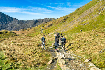 Fototapeta na wymiar Hikers on Pyg track at Pen-y Pass in Snowdon. North Wales