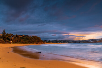Sunrise with scattered rain clouds at the seaside