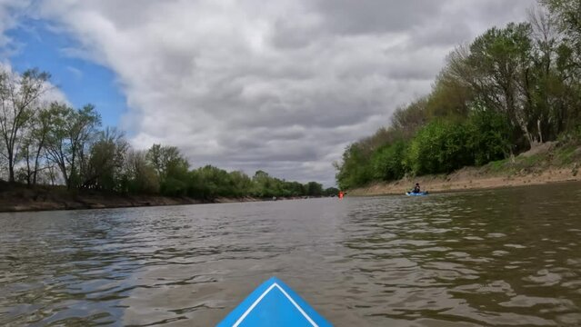 River paddling race, Mean Lamine, on the Lamine River in Missouri. POV from a bow of a stand up paddleboard.