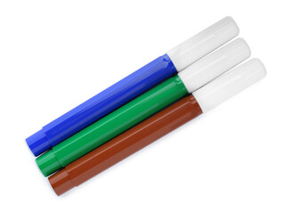 Different colorful markers on white background, top view