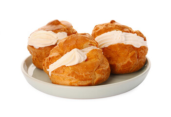 Delicious profiteroles with cream filling on white background