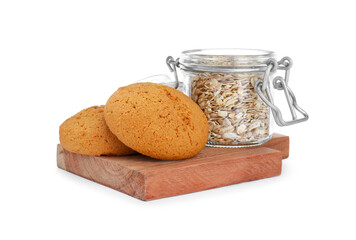 Delicious oatmeal cookies and flakes on white background