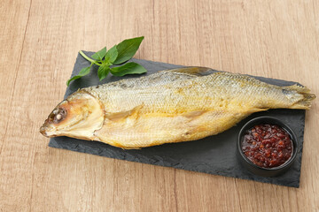 Bandeng Presto or Milkfish with high pressure cooked, served with chilli sauce (sambal), Indonesian food
