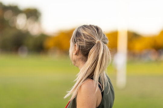 Head And Shoulders Of Lady With Dyed Blonde Hair From Behind