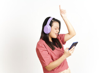 Naklejka premium Listening Music From Smartphone With Using Headphone Of Beautiful Asian Woman Isolated On White