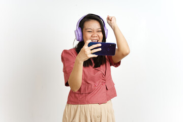 Obraz premium Playing Mobile Game on Smartphone with Headphone Of Beautiful Asian Woman Isolated On White