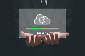 Backup storage data internet technology business concept, Businessman hand holding backup icon on...