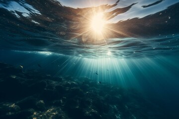 Fototapeta na wymiar Sun rays streaming through deep blue seawater, creating an entrancing underwater background of light. The sea waters appear untouched, pristine and tranquil. Generative AI