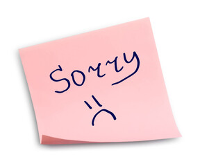Apology. Sticky note with word Sorry and drawn sad face on white background