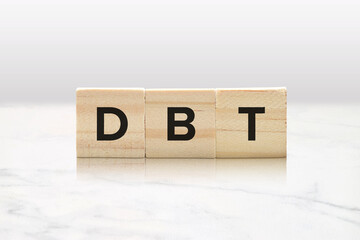 DBT on Wooden Blocks - Dialectical Behavior Therapy Mental Health Concept