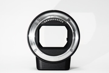 Mirrorless camera lens adapter isolated in white with copy space. 