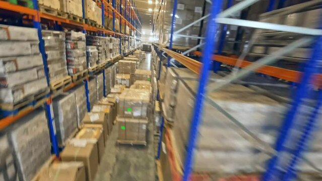 FPV Flight Inside Merchandise Warehouse With Racking System In Dominican Republic. - aerial