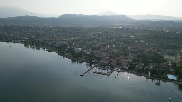 Aerial View Of A City Port Of Cisano With Lago di Garda, Province of Verona, Italy.