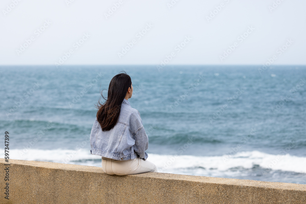 Sticker woman sit beside the waterfront in taiwan