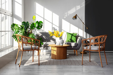 Interior of bright living room with armchairs, sofa and coffee table