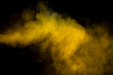 Fototapeta na wymiar Yellow steam on a black background.