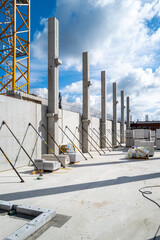 on a construction site concrete walls are supported with turnstiles