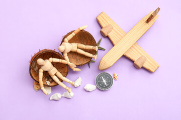 Composition with wooden plane, compass and mannequins sitting in coconut shell on lilac background