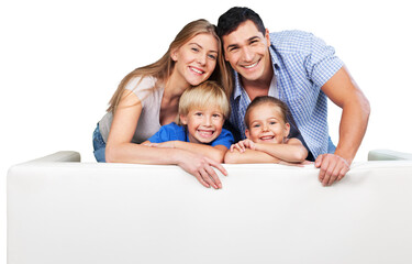 Beautiful smiling family in a room on couch