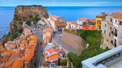 Scenic view with Ruffo castle in Scilla town, old town and blue sea on horizon. Calabria region,...