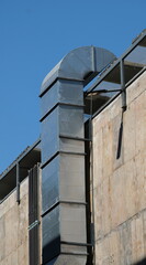 Fototapeta na wymiar Concrete wall mounted air ventilation duct