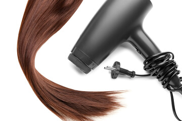 Brown hair with dryer on white background