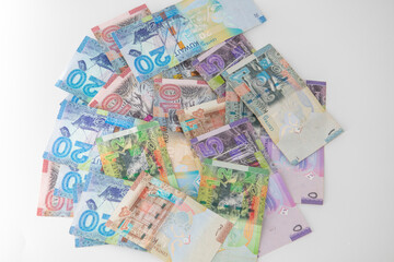Obraz na płótnie Canvas Selective focused , Full set of Kuwaiti Dinar bank paper notes. Kuwait dinar bank notes 0.25KWD, 0.5KWD, 1KWD, 5KWD, 10 KWD and 20 KWD. Kid trying to take the Kuwait dinar bank notes