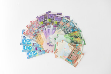 Selective focused , Full set of Kuwaiti Dinar bank paper notes. Kuwait dinar bank notes 0.25KWD, 0.5KWD, 1KWD, 5KWD, 10 KWD and 20 KWD. Kid trying to take the Kuwait dinar bank notes