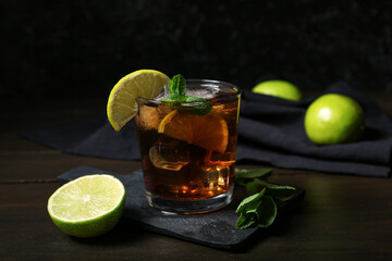 Glass of tasty Cuba Libre cocktail on table
