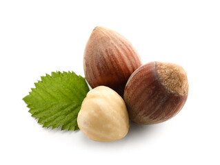 Hazelnuts with leaf on white background
