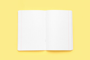Blank copybook pages on yellow background