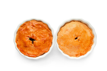 Tasty meat pot pies on white background