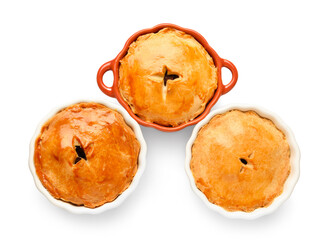 Tasty meat pot pies on white background