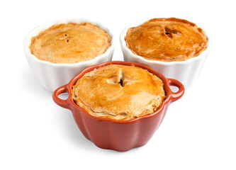 Tasty meat pot pies on white background