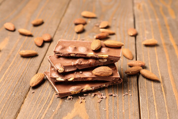 Sweet tasty chocolate with nuts on  wooden background