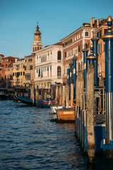Vertical shot of scenic location in Venice with old houses and canals on a sunny spring day. Concept of honeymoon trip or tourism in Italy. Copyspace