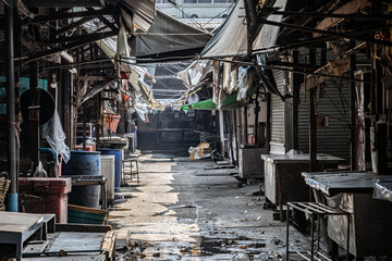 An abandoned street with closed shops and stands - a deserted marketplace, Thailand