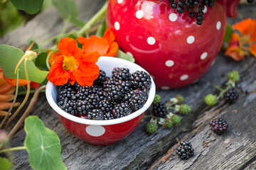Rustic Garden Still Life With Berries And Flowers - 597370943
