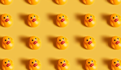 Obraz premium Rubber duckies pattern on plain background. Generative AI