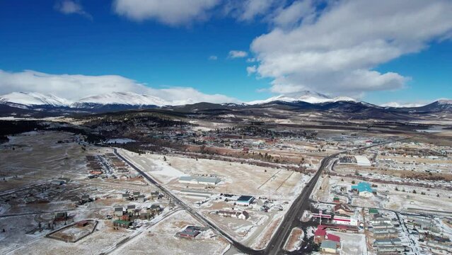 Drone Aerial View of Fairplay, CO on a sunny winter day with mountain peaks