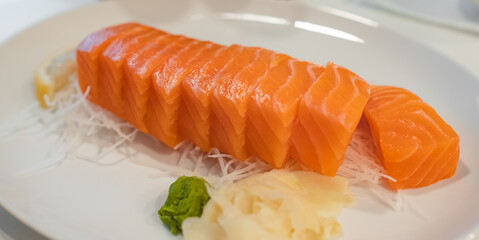 Salmon Sashimi fish Japanese food. Salmon raw sashimi on white plate.