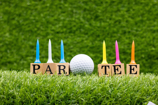 Golf party with golf ball and tee on green grass for golfer party invitation 