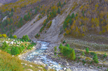 Fototapeta na wymiar River flowing in a mountain valley. Himachal Pradesh India South Asia Pacific
