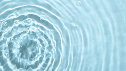 Abstract nature textured background, water waves in the pool with sun reflection, clear blue water. Web banner