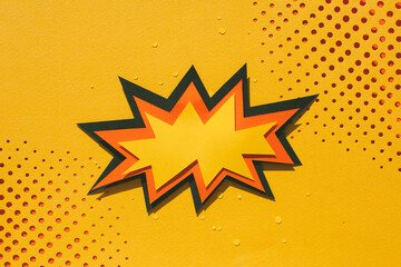 Handmade paper cutout pop art comic background with speech bubble. Cartoon flat style. In yellow and orange color.