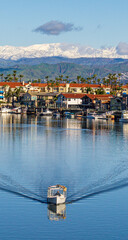 boats on in the harbor with snow 