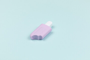 closeup of a popsicle on cyan surface icecream