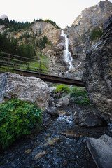 Adelboden, Switzerland - July 25, 2022 - Engstligen Falls falls in the Swiss Alps in the mountains.